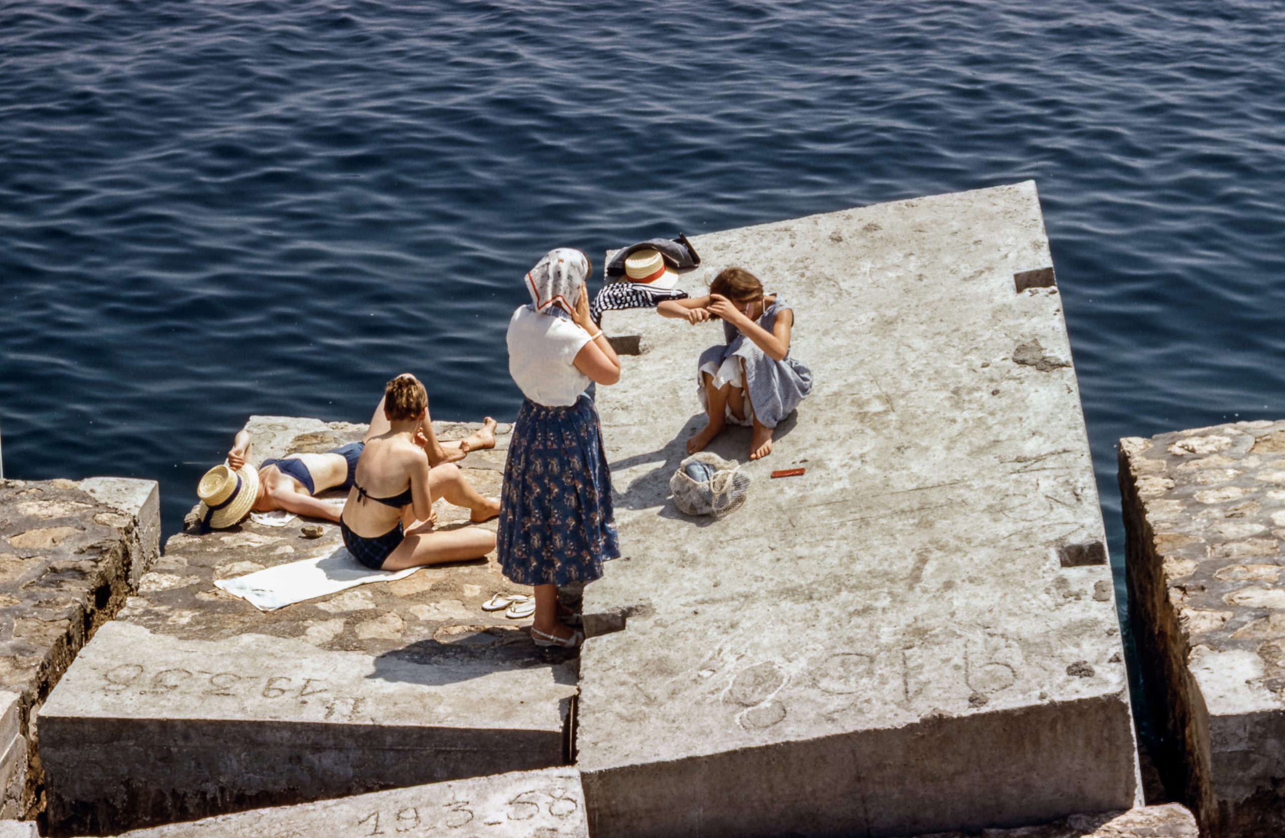 Vintage photograph of women by the ocean in swimsuits